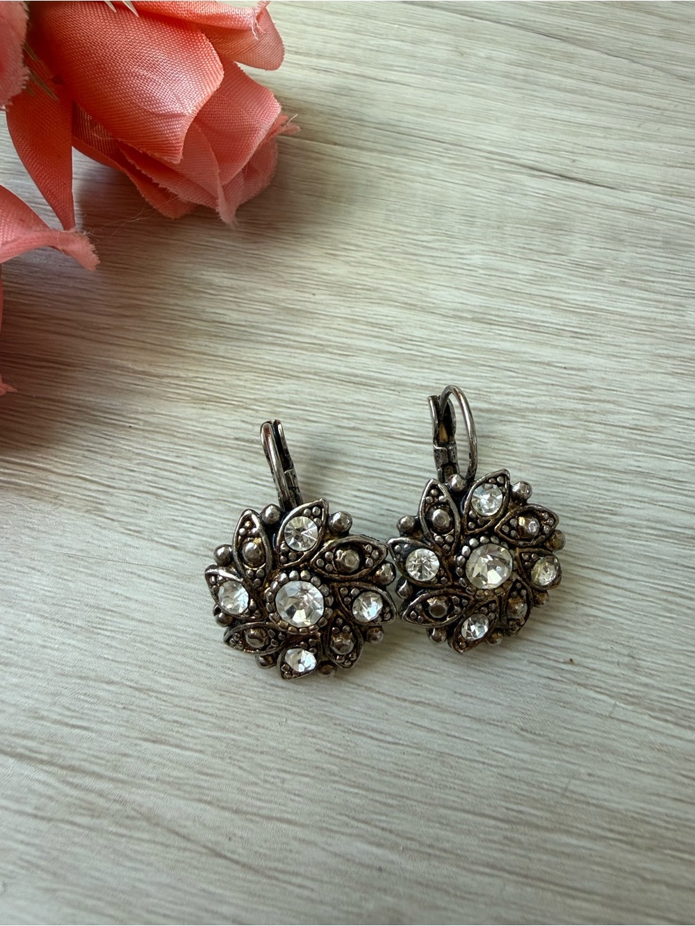 vintage-style earrings floral cluster design set with clear rhinestones.